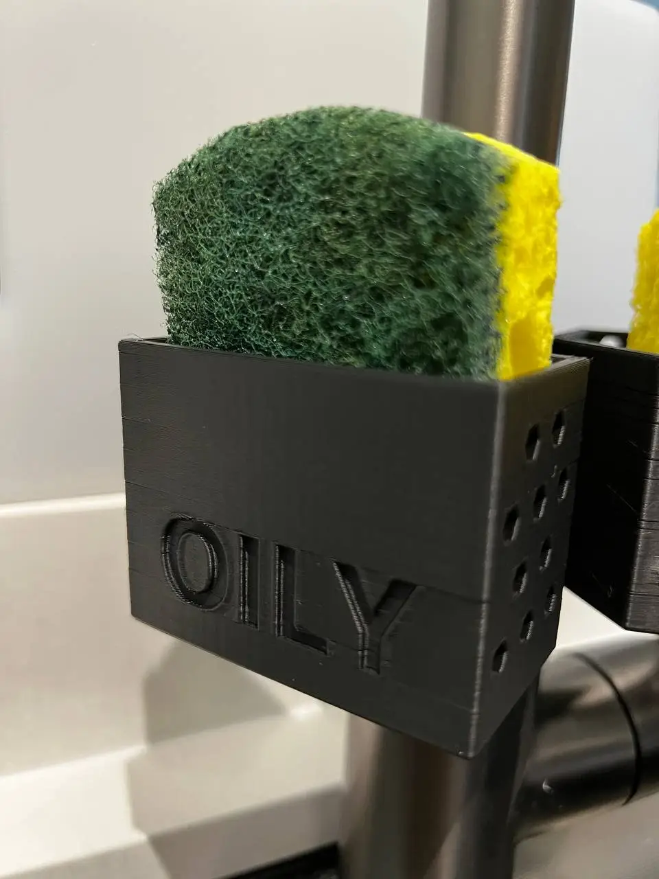 1mm Debossing of the "OILY" Holder Facade